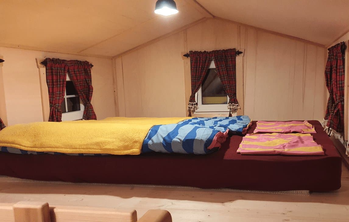 Bed in a GoTiny tiny house with a Matnext mattress underlay